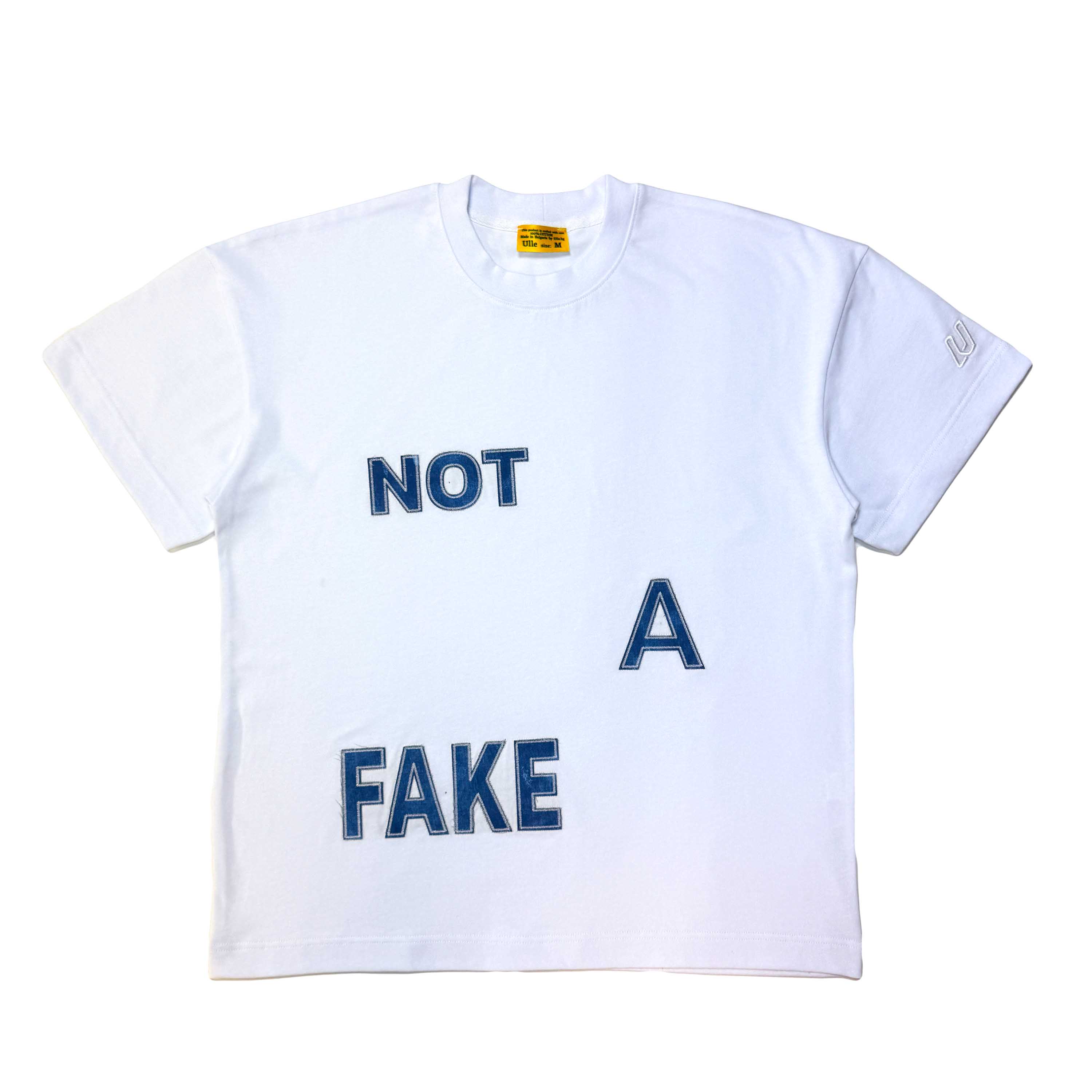 Тениска NOT A FAKE — бяла овърсайз с деним апликации и бродерия, ръчна изработка в български цех | Ulle